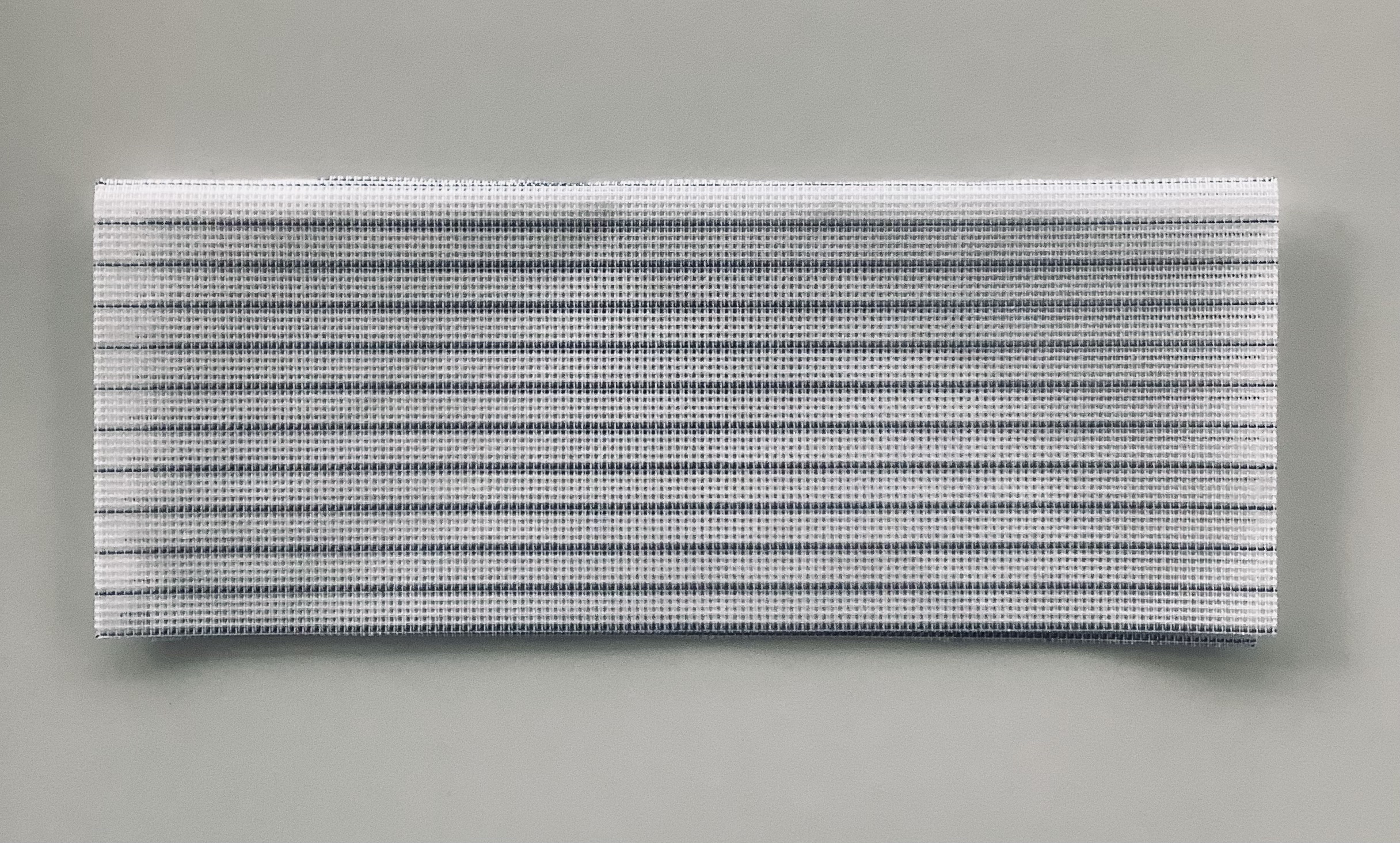 Waste canvas in two colors, with a blue thread every five holes