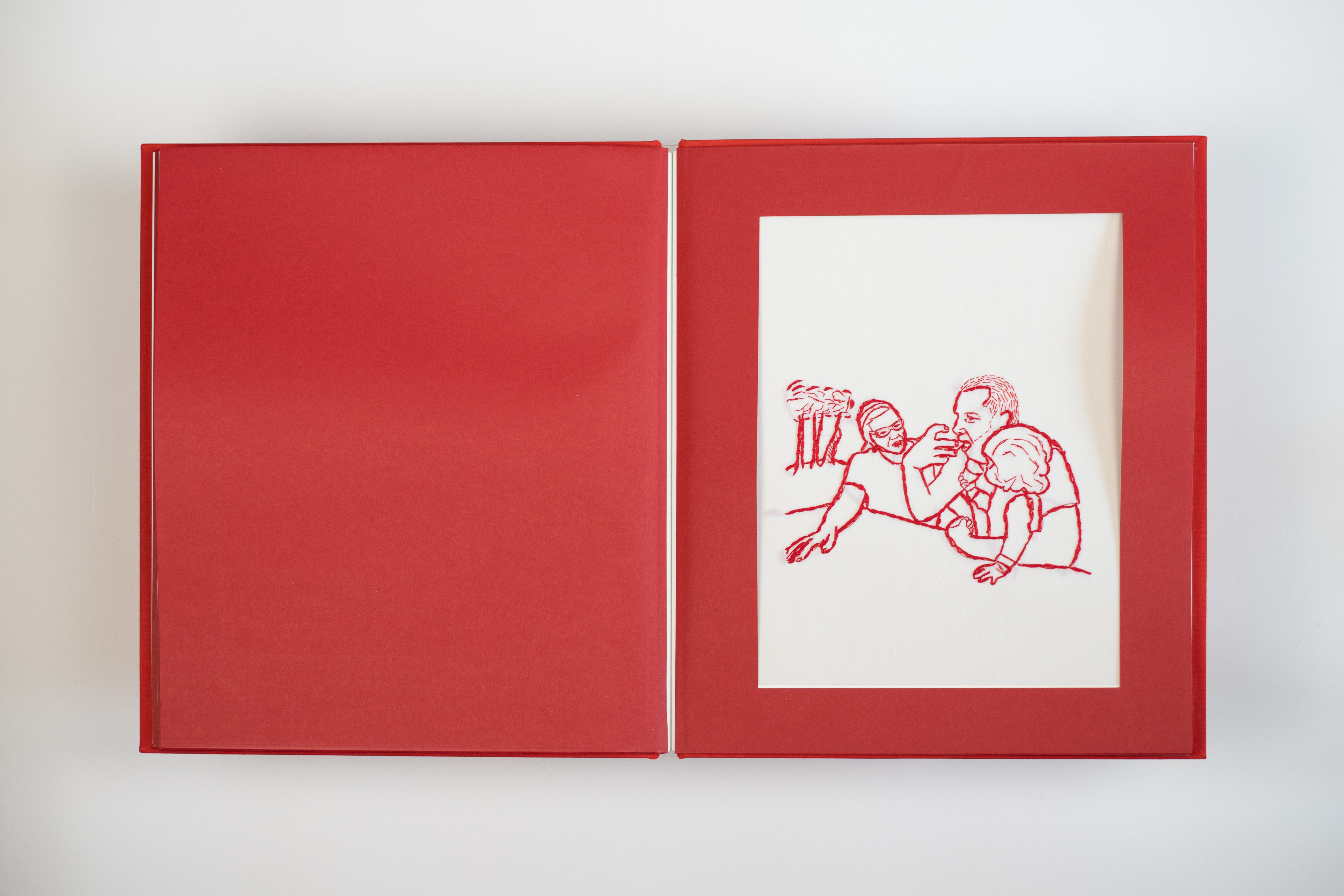 This handmade book showcases delicate red thread artistry, weaving together the simplicity and beauty of daily experiences