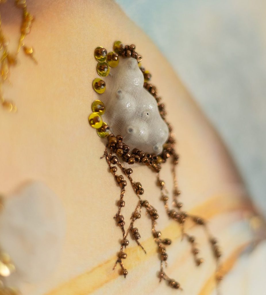 Gold work, beads, French knots